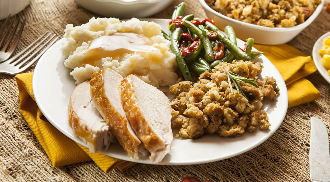 Holiday turkey and mash potatoes with a side of green beans and stuffing