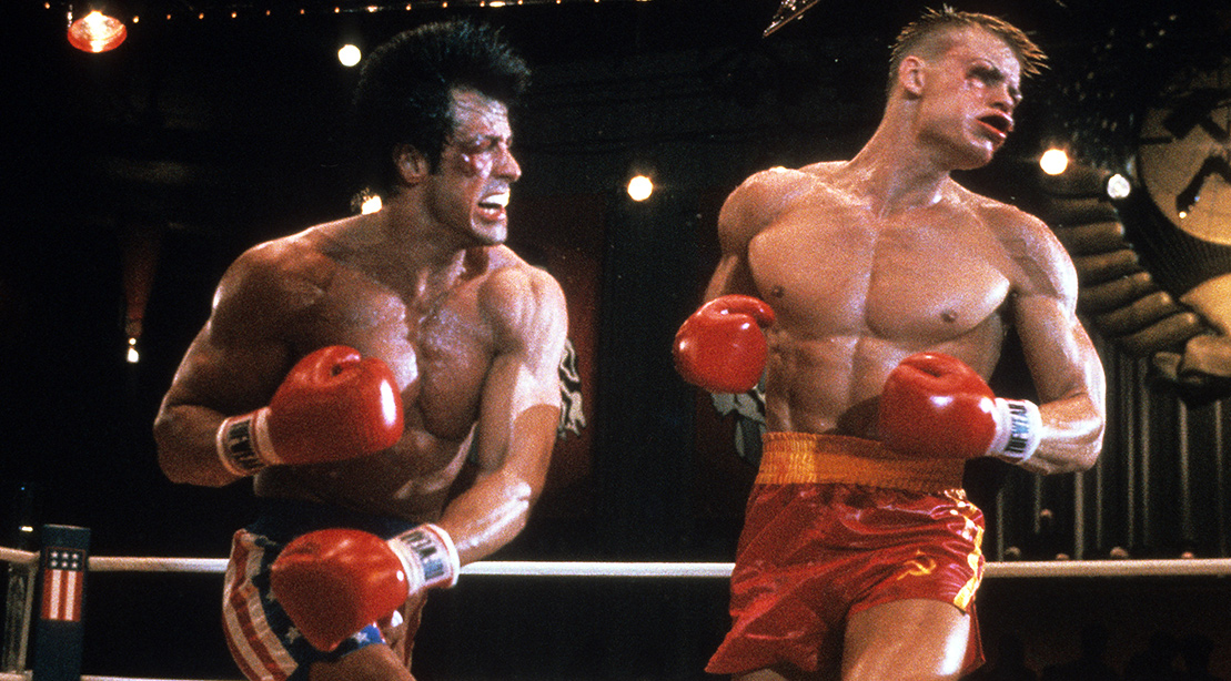 Sylvester Stallone punches Dolph Lundgren in a scene from the film 'Rocky IV', 1985