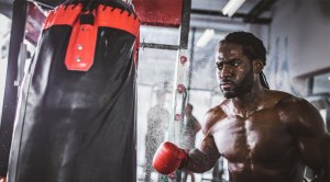 Boxer-Hitting-Heavy-Bag-Boxing