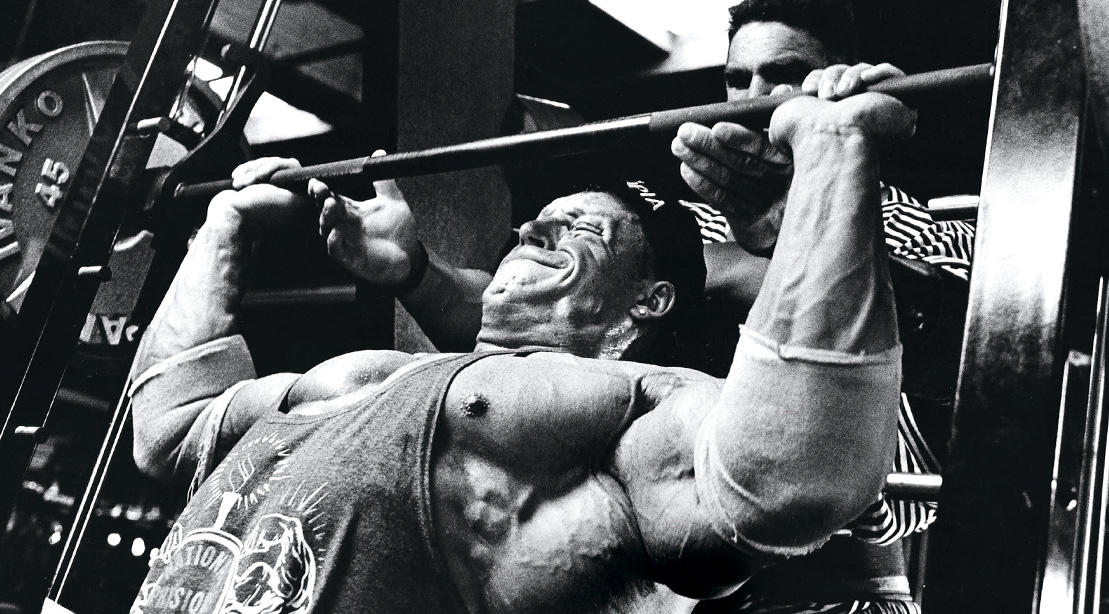 Bodybuilder Dorian Yates doing a chest workout performing a Incline Chest Press Exercise