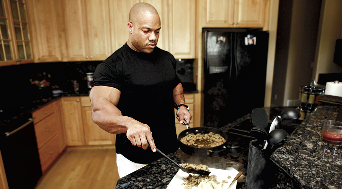 Bodybuilder Phil Heath cooking dinner in his home kitchen