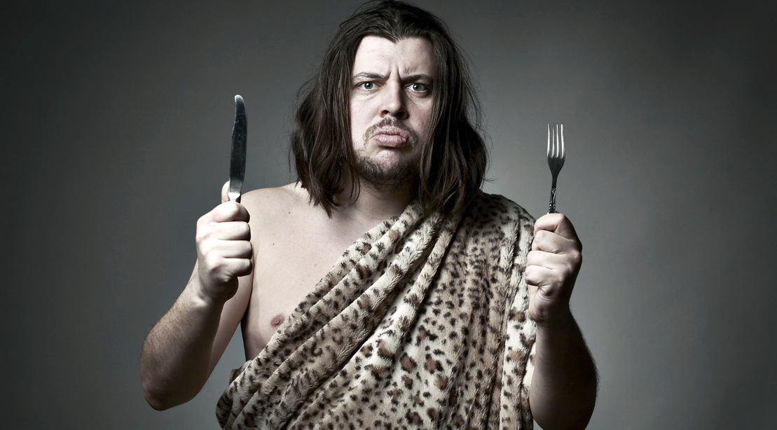 Caveman-Holding-Fork-and-Knife-Paleo-Diet