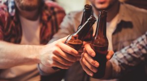 Group-Of-Guys-Cheering-Bottles-of-Beer