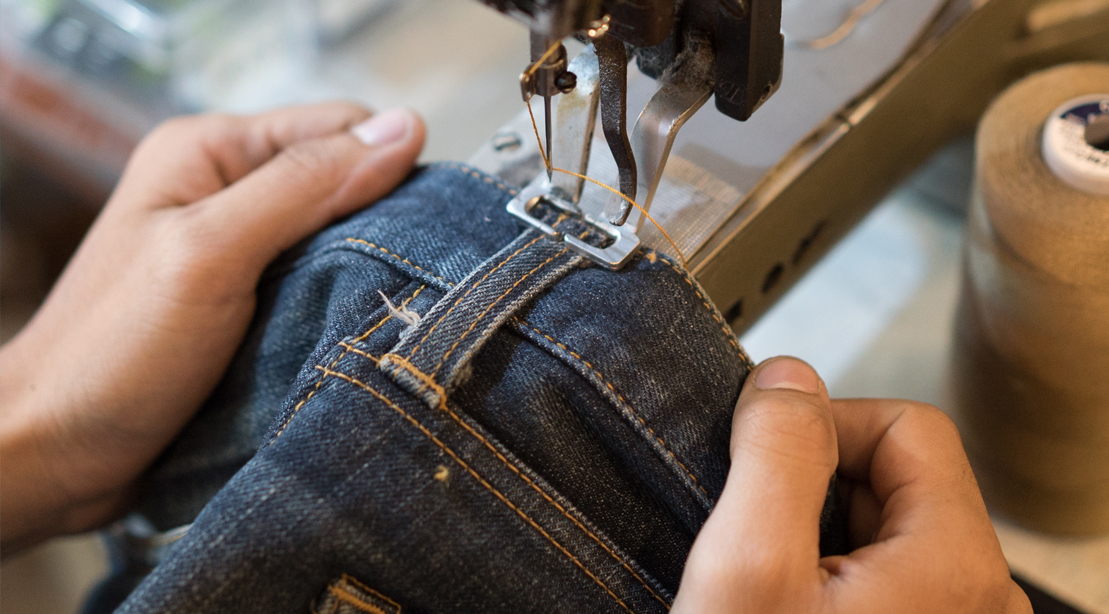 Person-Manufacturing-Jeans-Stitching