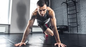 Male-With-Beard-Performing-Pushup-Knee-Tuck