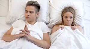 Young-Couple-In-Bed-Awkward