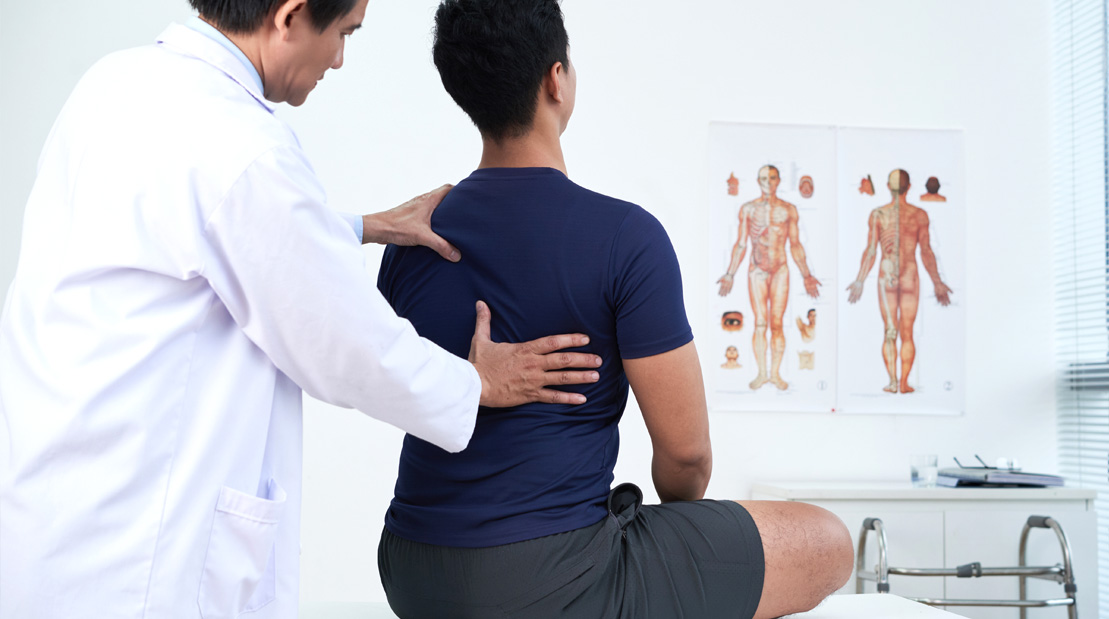 Doctor-Examining-Patient-Back-And-Posture
