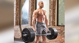 Muscular man performing a trap bar training exercise and trap bar shrug