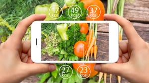 Person-Taking-Photo-Of-Vegetables-On-Iphone-With-Calories-Display