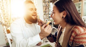 Pudgey-Male-With-Beard-Feeding-Girlfriends-French-Fry