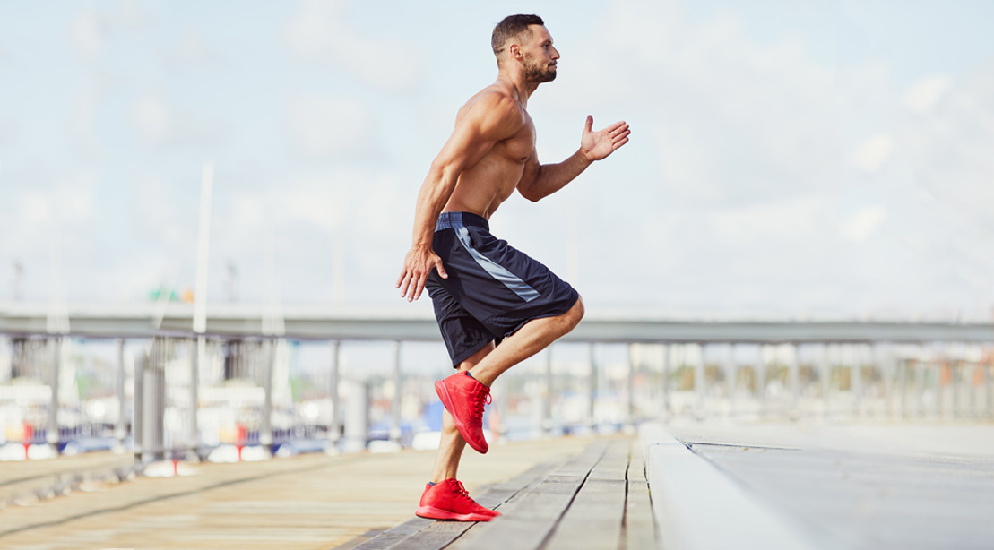 Man working out outdoors with HIIT