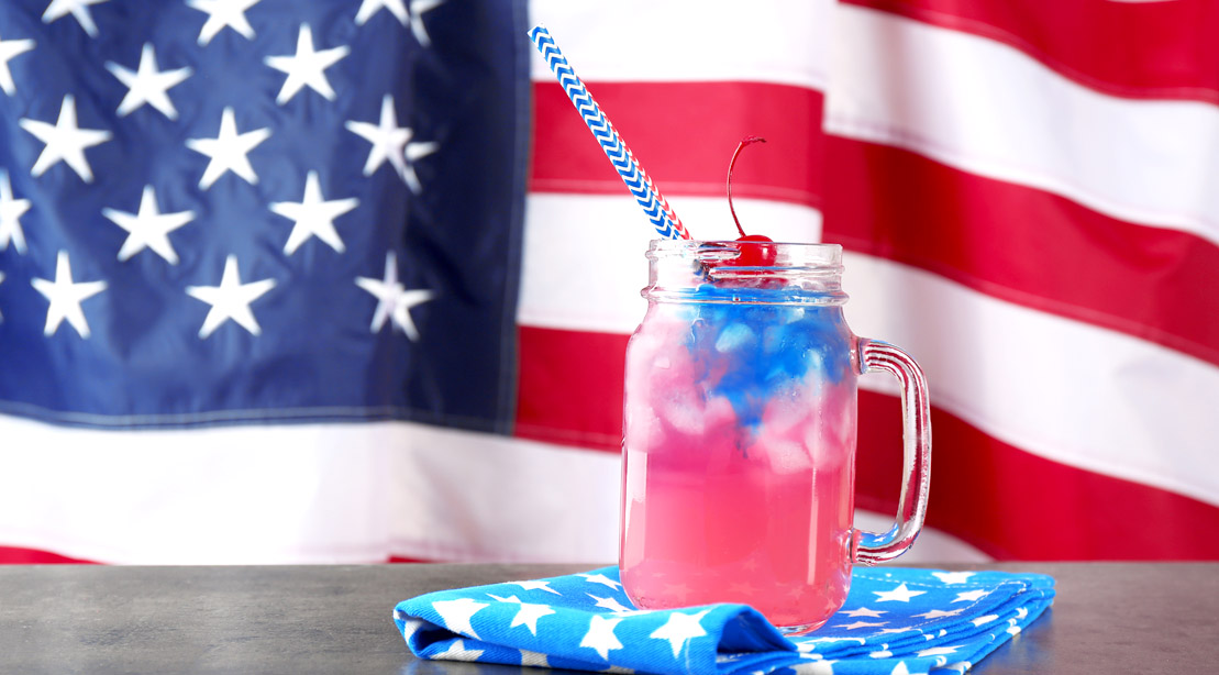 The American Flag and July 4th inspired cocktail in a mason jar