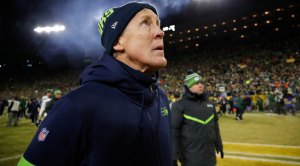 Seattle Seahawks Head Coach Pete Carroll looking at the time clock during a football game