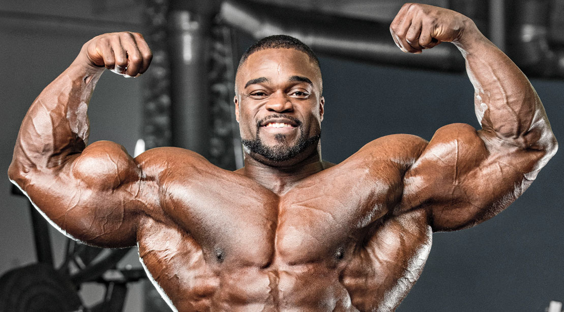 2019 Mr. Olympia Brandon Curry posing and showing off his big biceps
