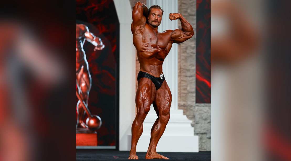 Bodybuilder Classic Physique winner Chris Bumstead posing at the Mr Olympia 2020 event