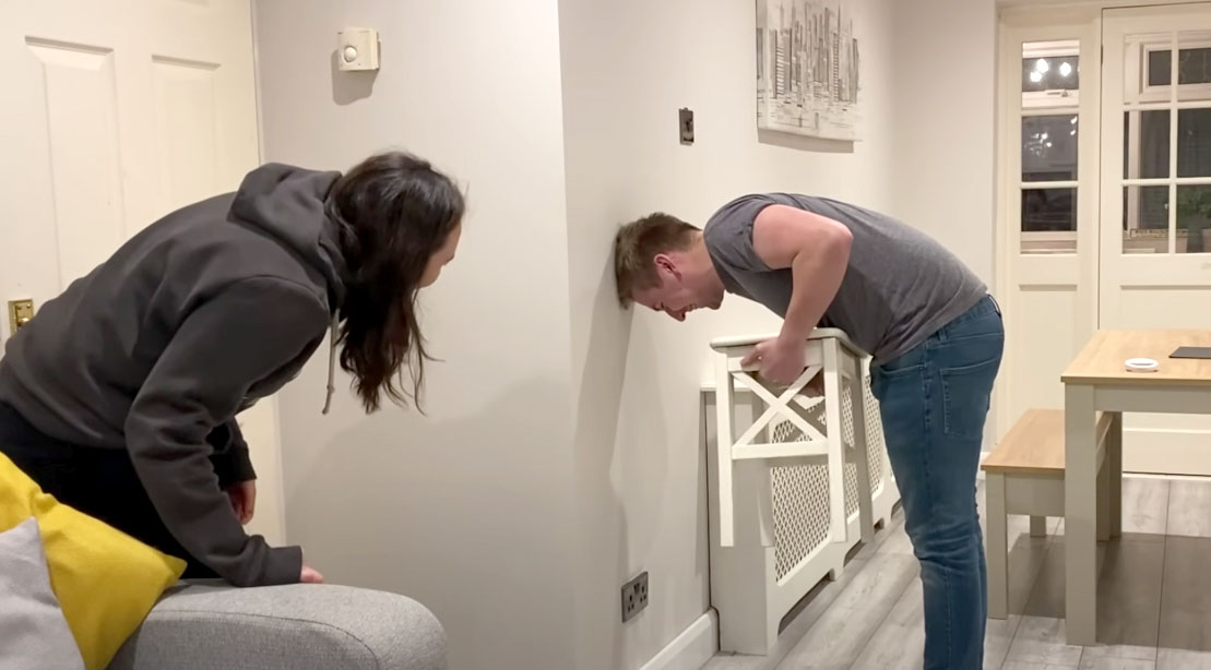 Male and female couple trying the Chair Challenge