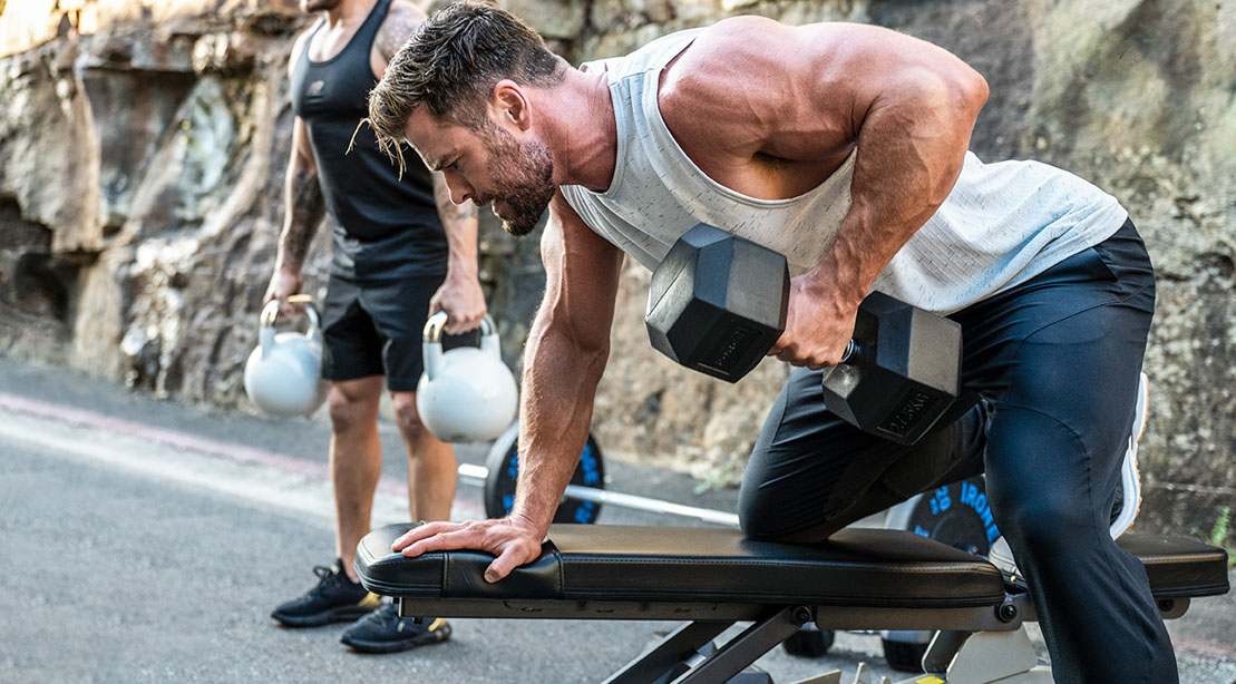 Actor and creater of the fitness app Centr Power App Chris Hemsworth working out with a dumbbell row exercise