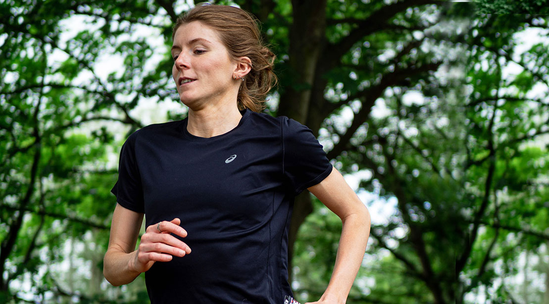 Triathlete Beth Potter running using her running tips to train for a thriathlon in the woods