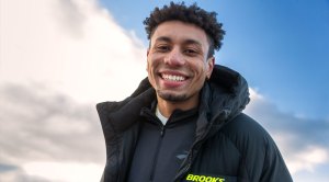 Middle-Distance runner Isaiah Harris wearing a Brooks running jacket