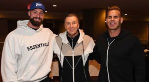 Bodybuilders Chris Bumstead and Jay Cutler taking a photo with NPC president Jim Manion