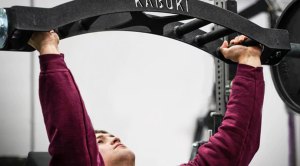 Man lifting a kabuki strength bar