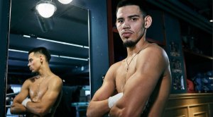 Boxer Diego Pacheco posing in the mirror