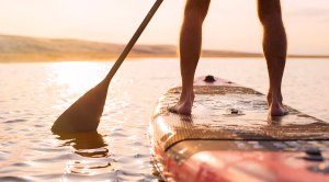 Person practicing stand up paddleboard