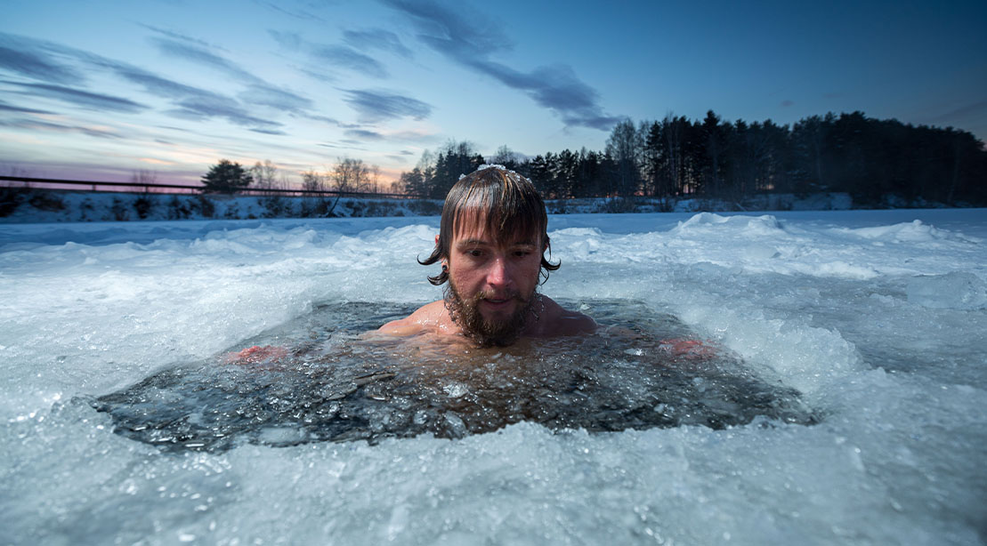 Man swimming in an ice cold lake