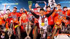 Chase Sexton celebrating his victory with his team at the 2023 AMA Supercross