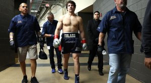 Richard Torrez Jr. walking the hallways of the arena towards a fight