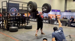 Strongman lifting truck tires at the America's Strongest series at the 2023 Olympia expo
