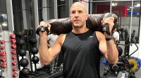 AEW’s Claudio Castagnoli carrying a bulgarian bag for his workout