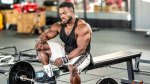 Bodybuilder Terrnace Ruffin sitting on a bench at the gym