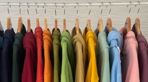 Colorful hoodies on a clothing rack