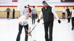 Former NFL player Jared Allen teaching his teammate how the basics of curling