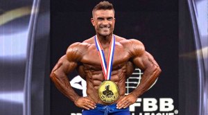 Ryan Terry wearing the Mr. Olympia Men’s Physique medal copy